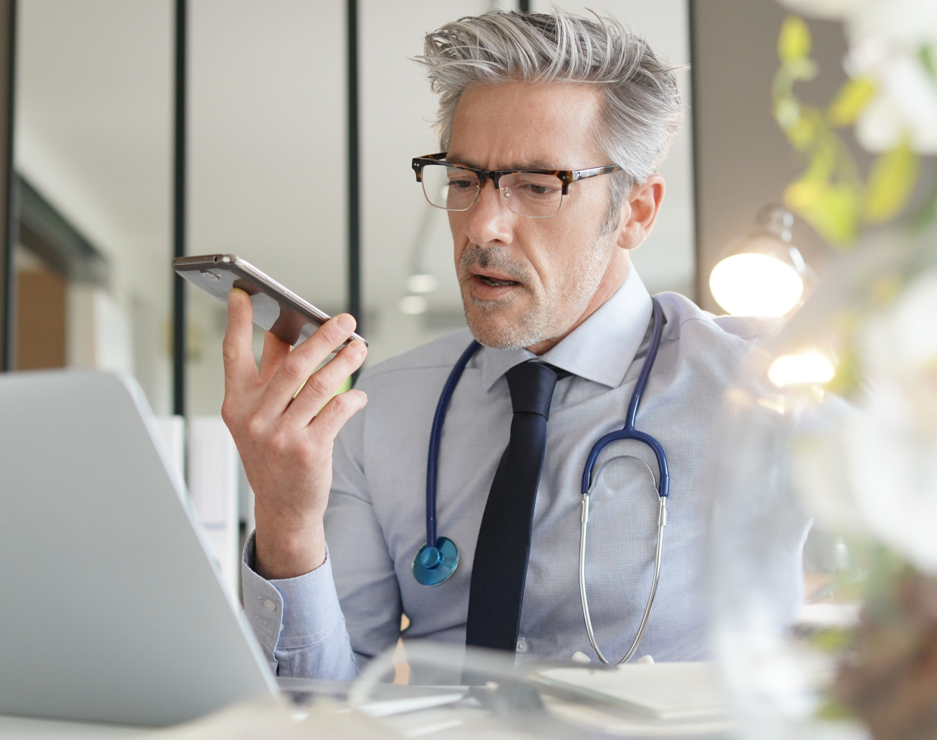 doctor talking on cellphone in modern office